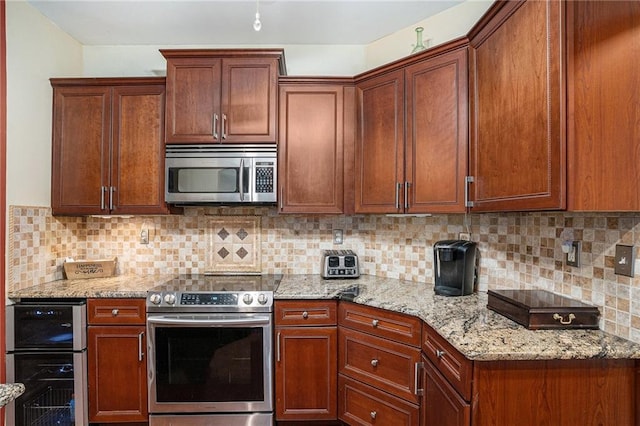 kitchen with light stone counters, wine cooler, tasteful backsplash, and stainless steel appliances