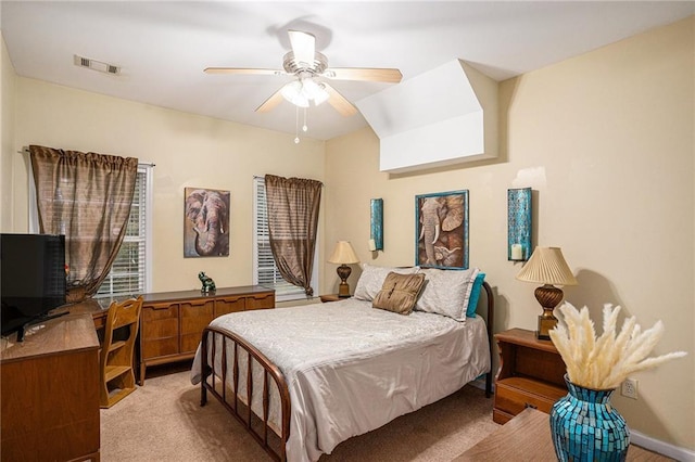 bedroom with visible vents, ceiling fan, and light carpet