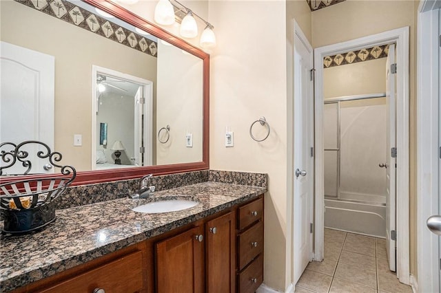 full bath featuring vanity, tile patterned flooring, and shower / bath combination with glass door