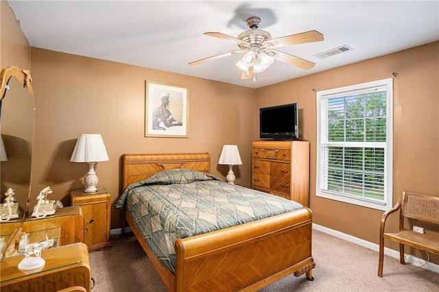 bedroom featuring carpet floors, baseboards, ceiling fan, and visible vents