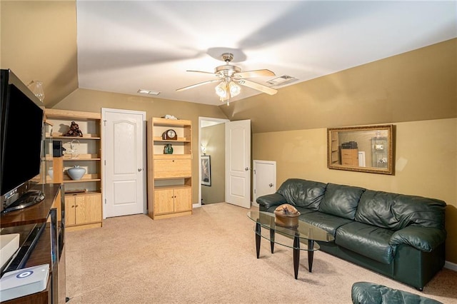 living area with vaulted ceiling, visible vents, a ceiling fan, and light colored carpet