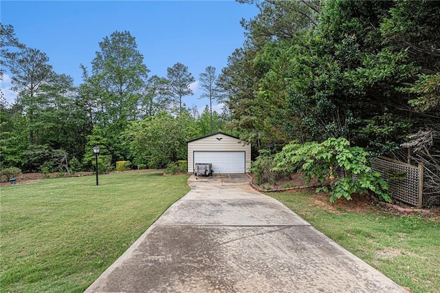 view of front of property with an outbuilding, a front lawn, and a garage