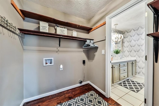 2057 High Shoals Rd, Dallas, GA 30132 - laundry area featuring electric dryer hookup, hookup for a washing machine, and wood finished floors