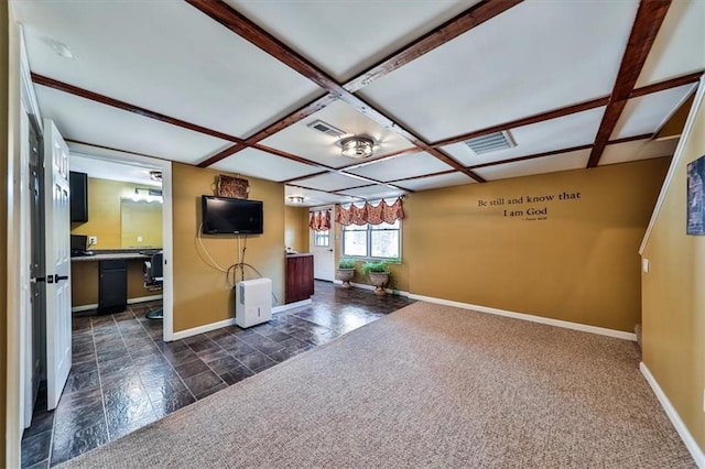 2057 High Shoals Rd, Dallas, GA 30132 - unfurnished living room with coffered ceiling, dark stone finish flooring, and beamed ceiling