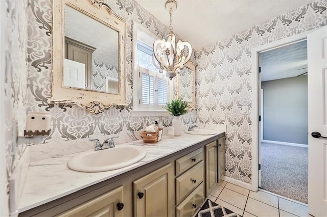 2057 High Shoals Rd, Dallas, GA 30132 - bathroom featuring wallpapered walls, double vanity, a chandelier, a textured ceiling, and tile patterned flooring