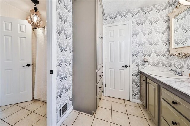 2057 High Shoals Rd, Dallas, GA 30132 - full bathroom with wallpapered walls, vanity, and tile patterned floors