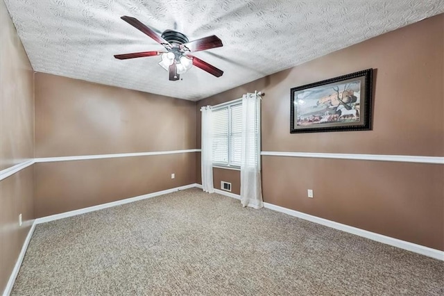 2057 High Shoals Rd, Dallas, GA 30132 - empty room featuring ceiling fan, a textured ceiling, and carpet