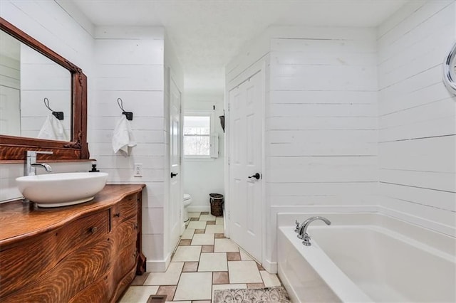 2057 High Shoals Rd, Dallas, GA 30132 - bathroom with vanity, a bath, and wood walls