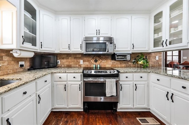 2057 High Shoals Rd, Dallas, GA 30132 - kitchen with appliances with stainless steel finishes and white cabinets