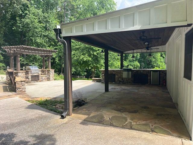 2057 High Shoals Rd, Dallas, GA 30132 - view of patio / terrace with area for grilling, ceiling fan, a pergola, and a carport