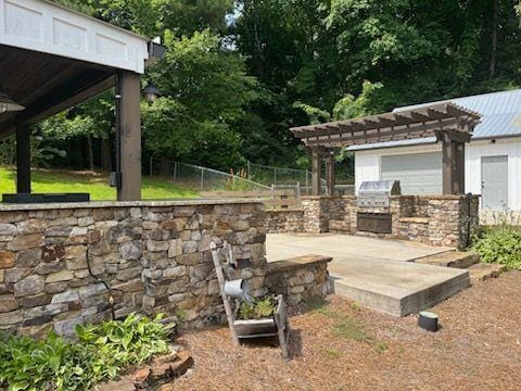 2057 High Shoals Rd, Dallas, GA 30132 - view of patio / terrace with exterior kitchen and a pergola