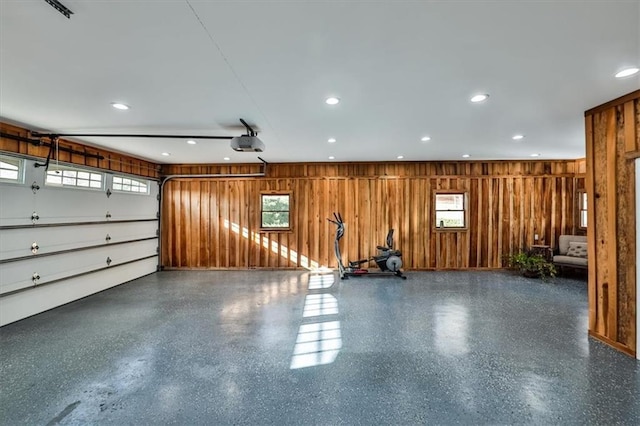 2057 High Shoals Rd, Dallas, GA 30132 - garage with wooden walls, a garage door opener, and recessed lighting