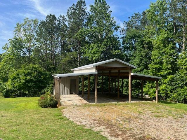 2057 High Shoals Rd, Dallas, GA 30132 - view of community featuring a lawn and a carport