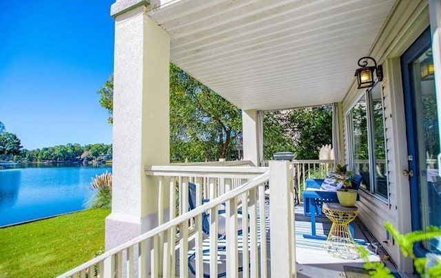 balcony featuring a water view