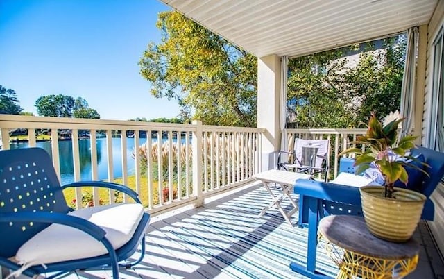 balcony featuring a water view