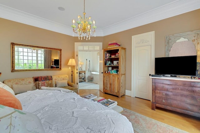 bedroom with ensuite bathroom, light wood-type flooring, a notable chandelier, and ornamental molding