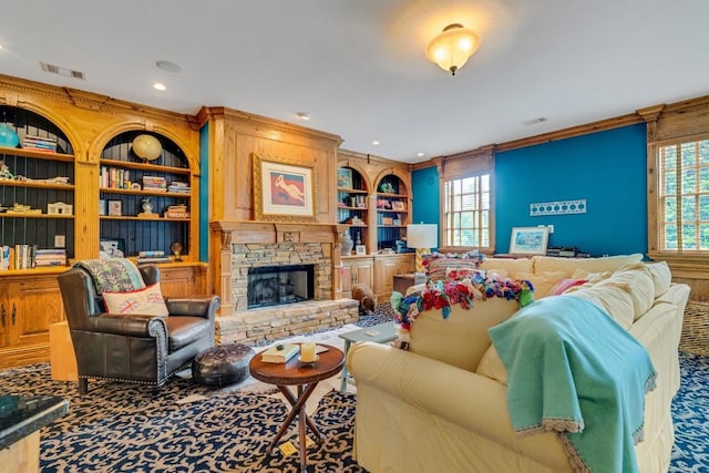 carpeted living room featuring a fireplace, built in shelves, and ornamental molding