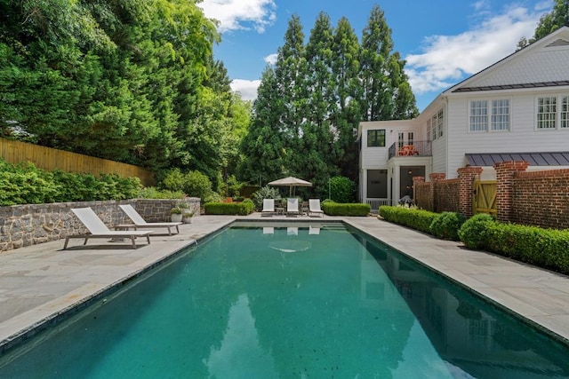 view of swimming pool with a patio