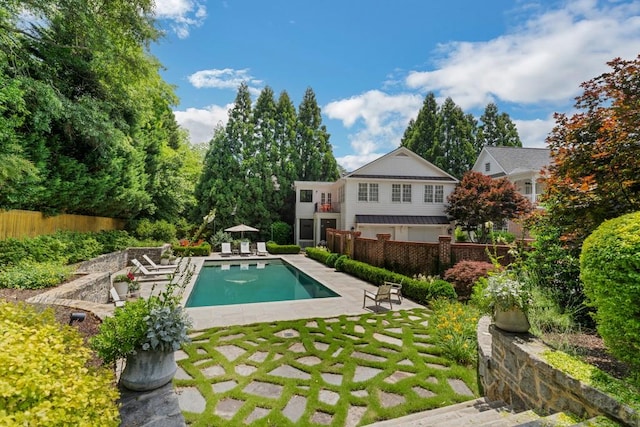 view of swimming pool with a patio area