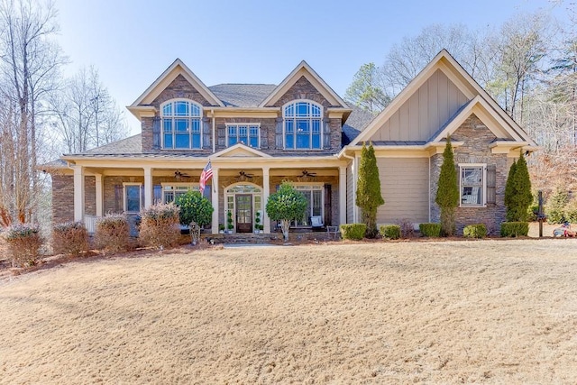 craftsman house featuring covered porch, ceiling fan, and a front lawn