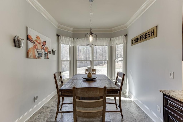 dining area featuring ornamental molding