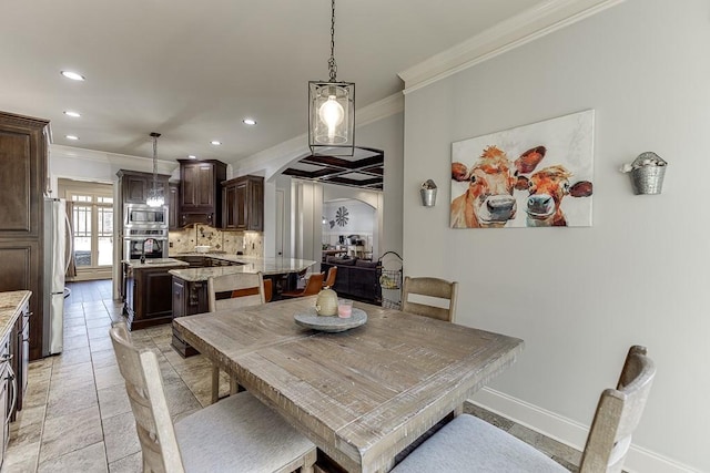 dining space with crown molding