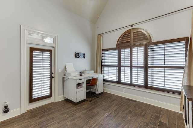 office area with dark hardwood / wood-style flooring and lofted ceiling