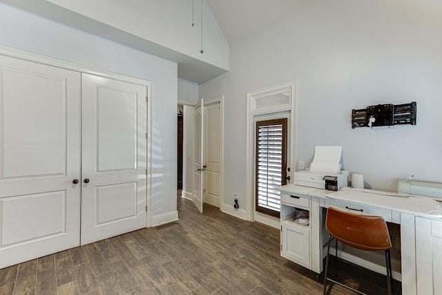 office area featuring lofted ceiling and dark wood-type flooring