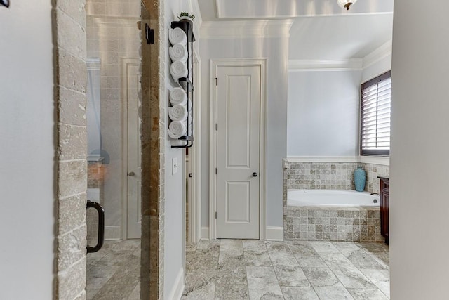 bathroom with ornamental molding and plus walk in shower