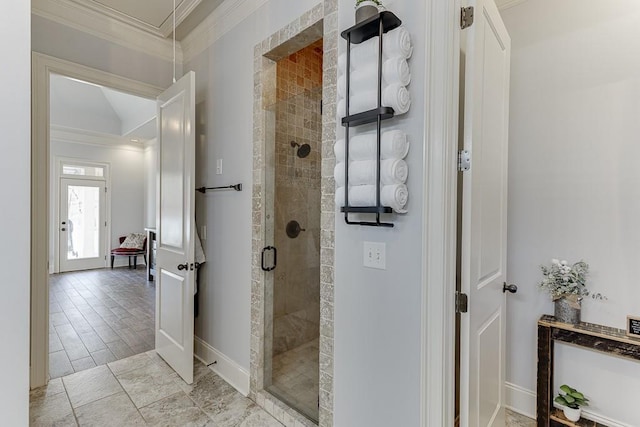 bathroom featuring an enclosed shower and ornamental molding