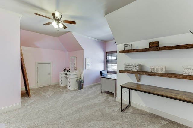 office area with ceiling fan, crown molding, and light colored carpet