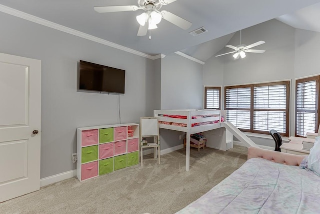 carpeted bedroom with vaulted ceiling, crown molding, and ceiling fan