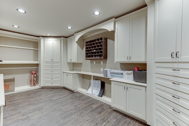 kitchen featuring light hardwood / wood-style floors and white cabinetry