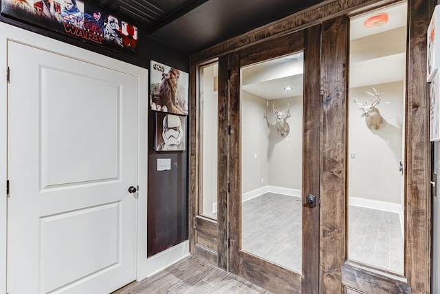 doorway to outside featuring light wood-type flooring