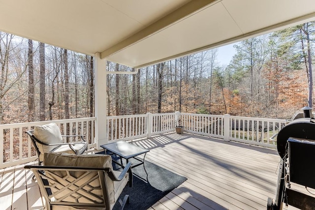 wooden deck featuring grilling area