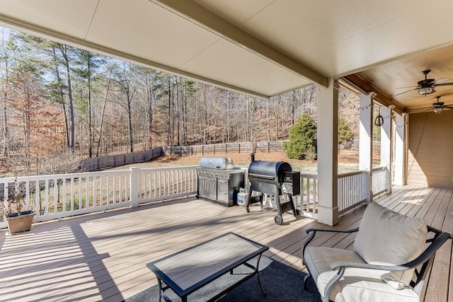 deck with area for grilling and ceiling fan