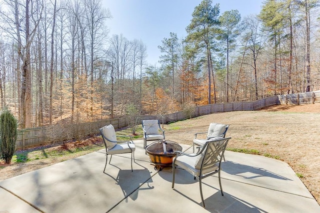 view of patio with an outdoor fire pit