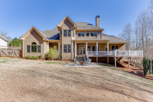 view of front of home with a front yard and a patio