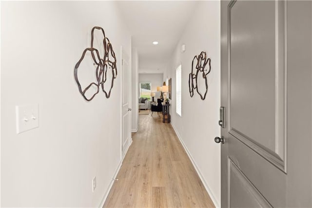 hall with light hardwood / wood-style floors