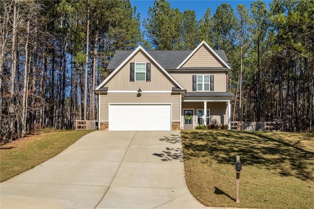 craftsman house featuring a front yard, a porch, and a garage