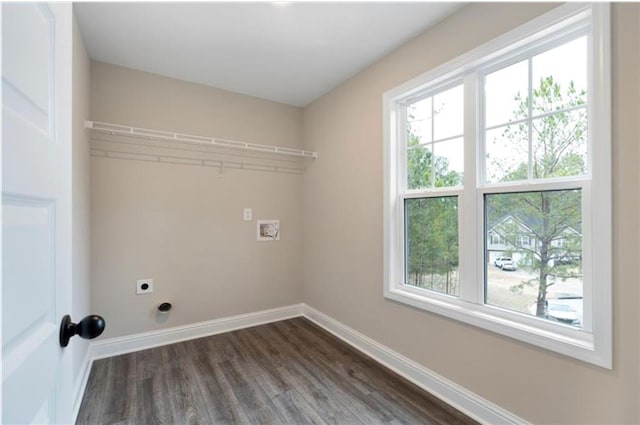 laundry area with dark hardwood / wood-style flooring and hookup for an electric dryer