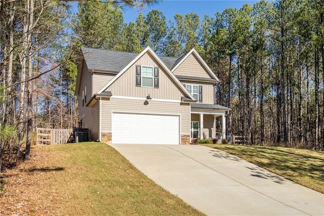 craftsman inspired home featuring a porch, cooling unit, a garage, and a front yard