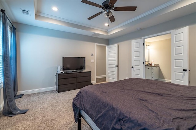 carpeted bedroom featuring ceiling fan, a raised ceiling, and crown molding