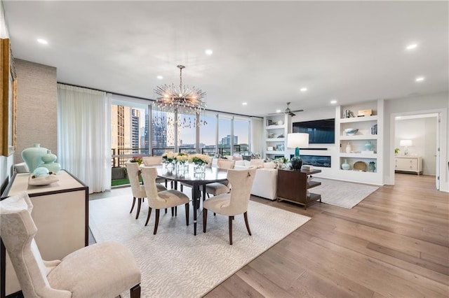 700 Park Regency Pl NE Unit 1605, Atlanta, GA 30326 - dining room featuring a ceiling fan, light wood-style floors, a chandelier, and recessed lighting