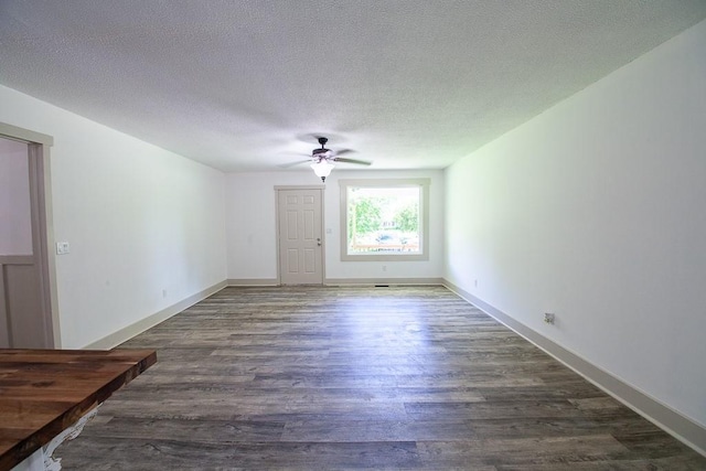 178 Wayne St SW, Calhoun, GA 30701 - empty room with ceiling fan, dark wood finished floors, and a textured ceiling