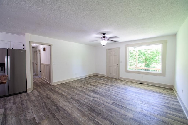178 Wayne St SW, Calhoun, GA 30701 - unfurnished living room featuring ceiling fan, dark wood-style floors, a textured ceiling, and baseboards