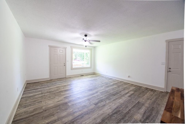 178 Wayne St SW, Calhoun, GA 30701 - unfurnished room with wood finished floors, a textured ceiling, ceiling fan, and baseboards