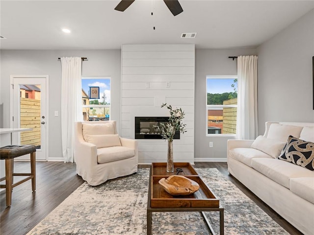 5649 Hislop Ln Unit 90, Mableton, GA 30126 - living area featuring dark wood-style flooring, a ceiling fan, recessed lighting, a large fireplace, and baseboards