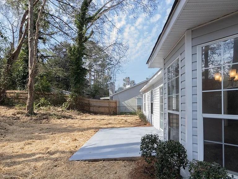 view of yard featuring a patio area and fence