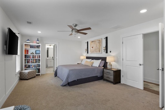 bedroom with visible vents, ceiling fan, light carpet, recessed lighting, and ensuite bathroom